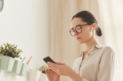 Elegant Adult Woman Using Smartphone